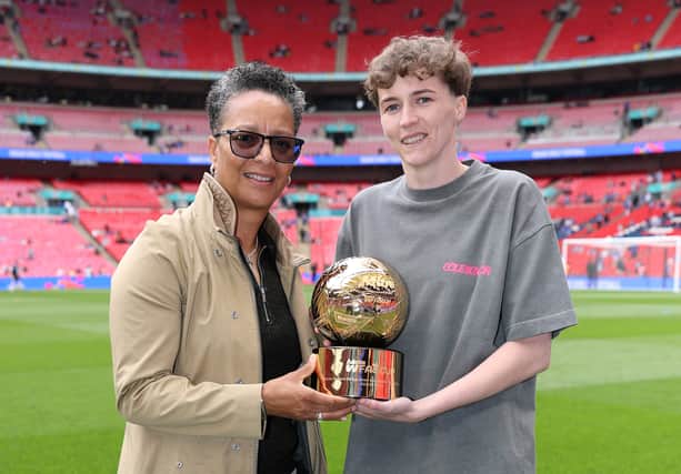 Madison Hadley of Preston North End is presented with Mitre Golden Ball trophy by Hope Powell prior to The Adobe Women's FA Cup Final match between Chelsea and Manchester United